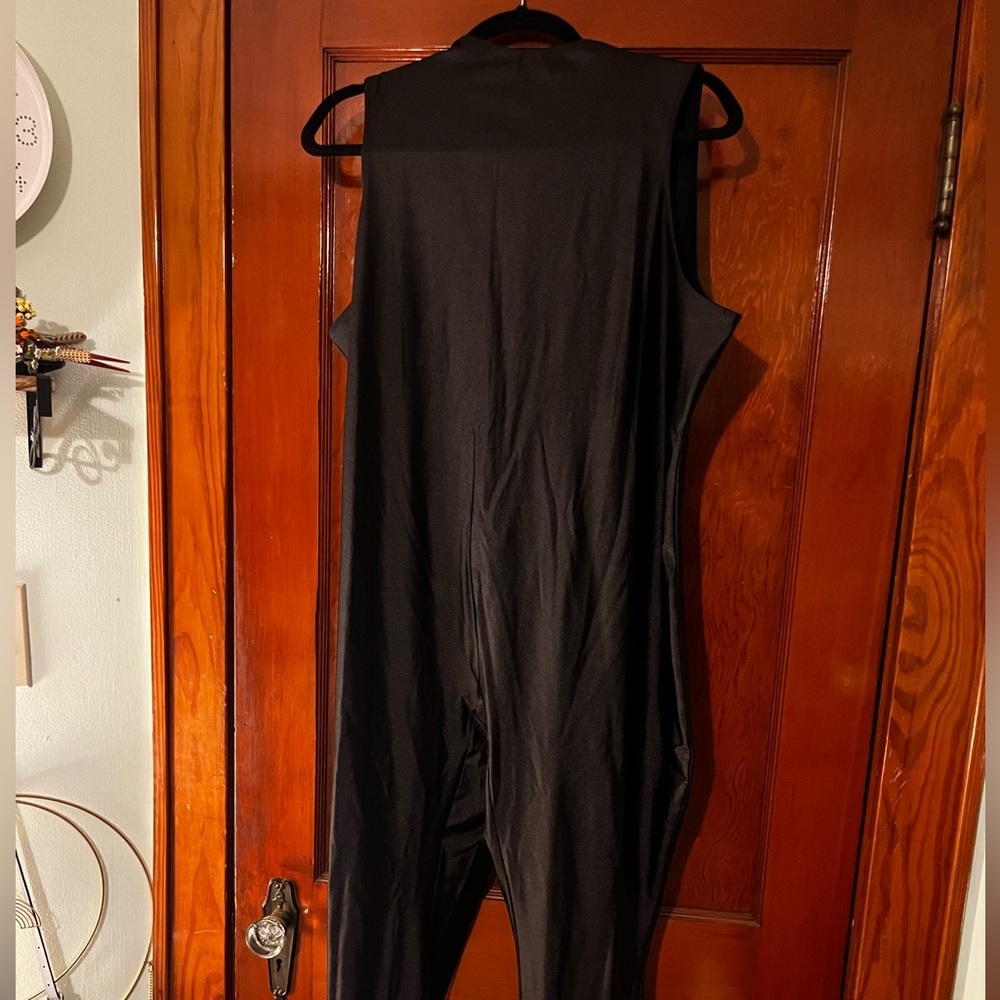 Black new with tags skims jumpsuit romper.
